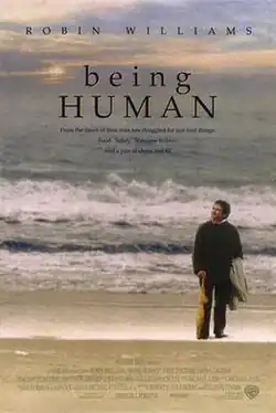 A man walking along the sea shore