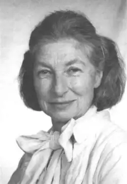 Photograph of H. Catherine W. Skinner, an older pale-complexioned woman with chin-length hair wearing a white blouse.
