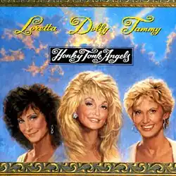 photo of Loretta Lynn, Dolly Parton, and Tammy Wynette with clouds