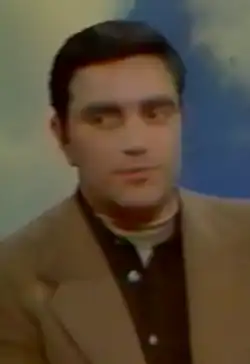 Miguères in a suit