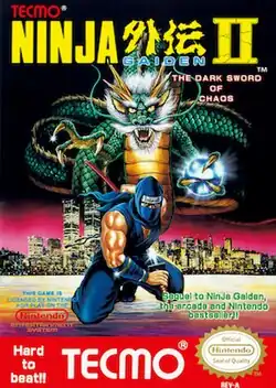 The logo of Ninja Gaiden II: The Dark Sword of Chaos is on the top of the screen. In the middle of the image is a depiction of a ninja in violet either sheathing or unsheathing a katana from the scabbard. The ninja is portrayed in the background of a nighttime city with a dragon rising over. To the bottom right of the ninja is green text saying "Sequel to NinJa Gaiden, the arcade and Nintendo best seller!", and to the left of that is a license by Nintendo. The bottom right bears the Nintendo Seal of Quality stamp. In the bottom of the image, in red with white lettering, is the Tecmo logo, with text to the left of the logo saying "Hard to beat!!".