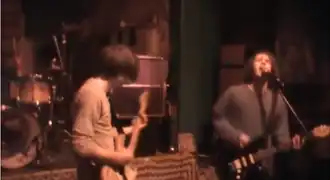 Roomrunner performing live in 2012, as seen in a video still.