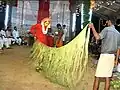 Channel/medium tying the siri&nbsp;— palm leaves skirt around his waist