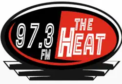 Abstract red and black design with text reading "97.3 FM The Heat"